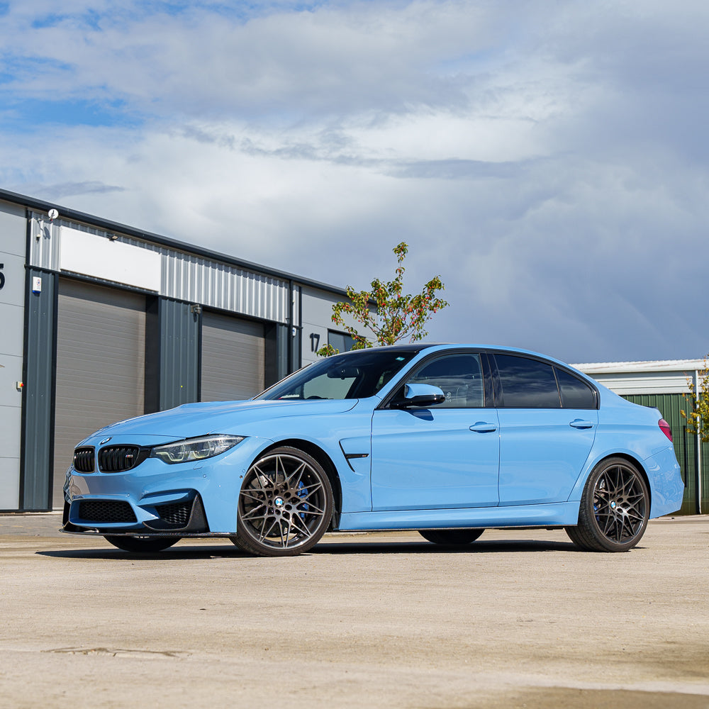 Blue BMW M3 F80 full carbon fiber kit by CT Carbon, showcasing lightweight, high-quality carbon fiber components for the vehicle.