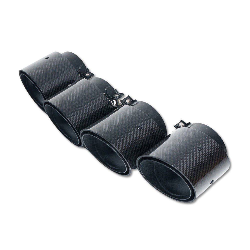Set of four black slash cut carbon exhaust tips for BMW M2, M3, M4 G87 G80 G81 G82 G83 by CT Carbon, stylish and durable.