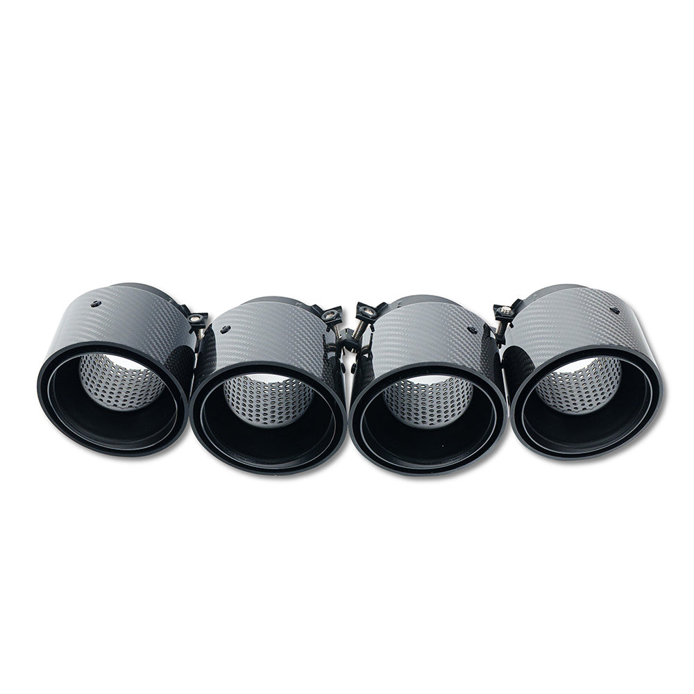 Set of four black carbon exhaust tips for BMW M2, M3, M4 G87/G80/G81/G82/G83 by CT Carbon, with slash cut design.