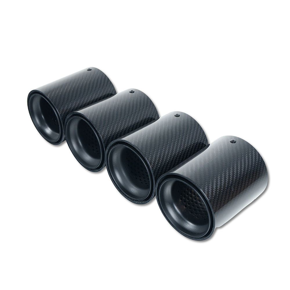 Set of four BMW F90/F92 M5 carbon fiber exhaust tips in matte black by CT Carbon, showcasing sleek, high-performance design.
