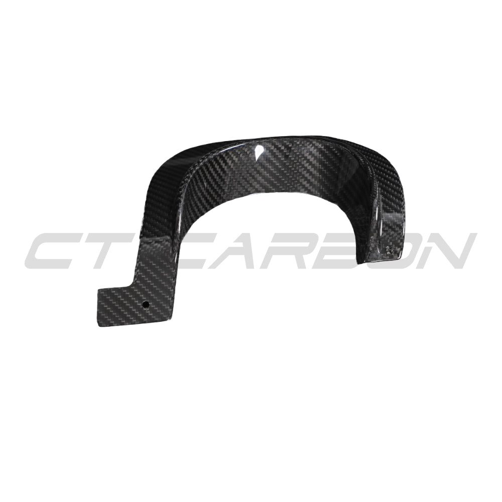 Close-up of CT Carbon Toyota Supra A90 2019+ carbon fiber exhaust diffuser cover on a vehicle, showcasing sleek black finish and textured details.