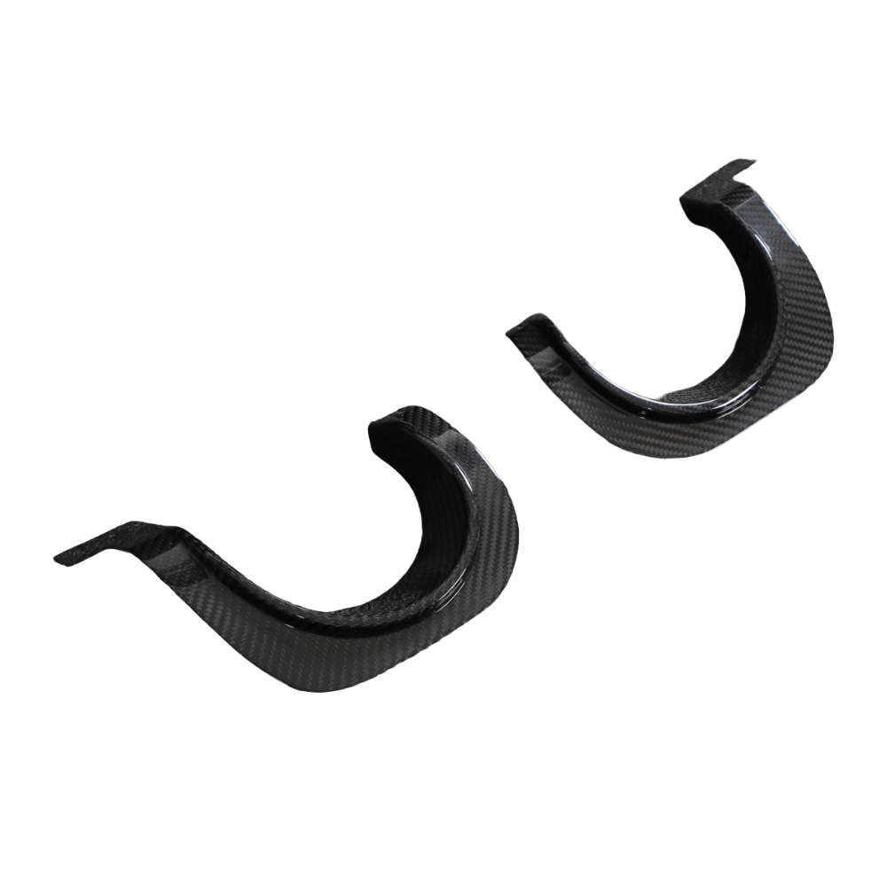 Carbon fiber exhaust diffuser cover for Toyota Supra A90 2019+ by CT Carbon, showcasing sleek, textured finish on the car's rear.