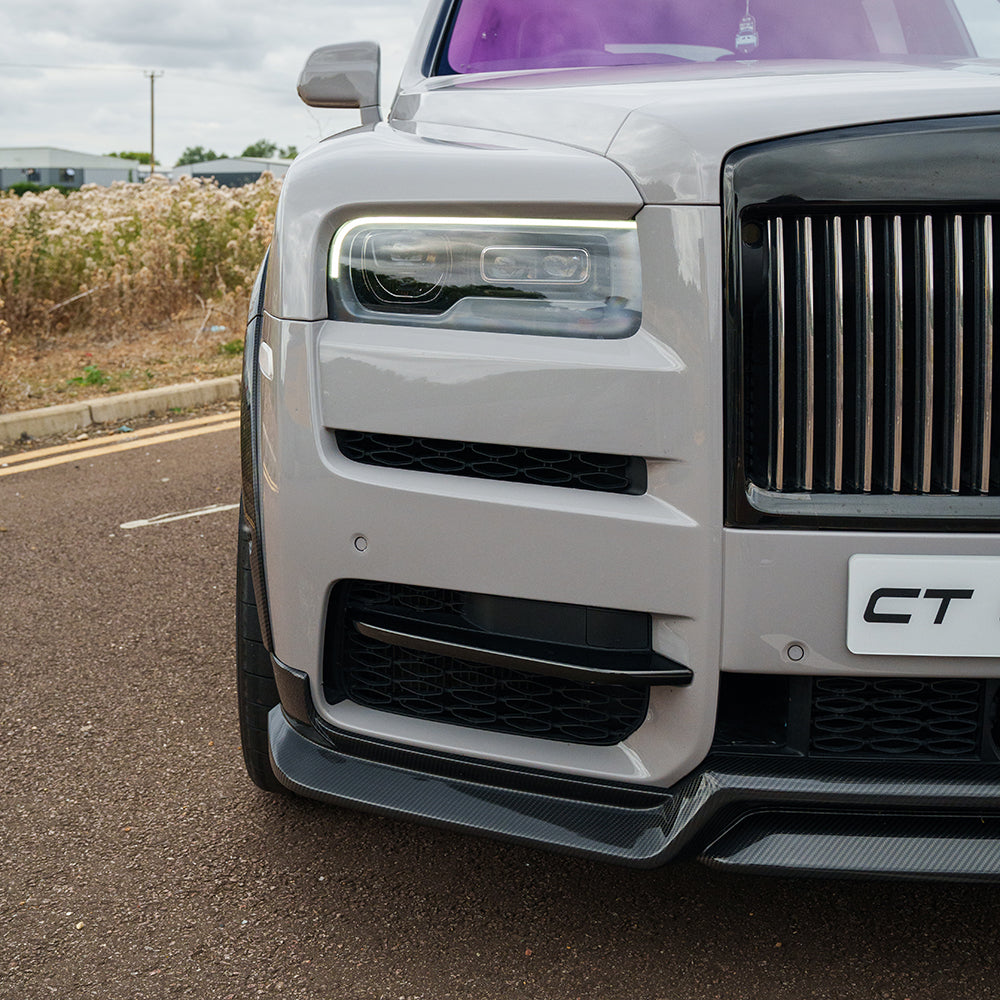 Carbon fiber splitter on a Rolls Royce Cullinan, featuring a sleek CT Carbon design with a smooth finish and precise fit.