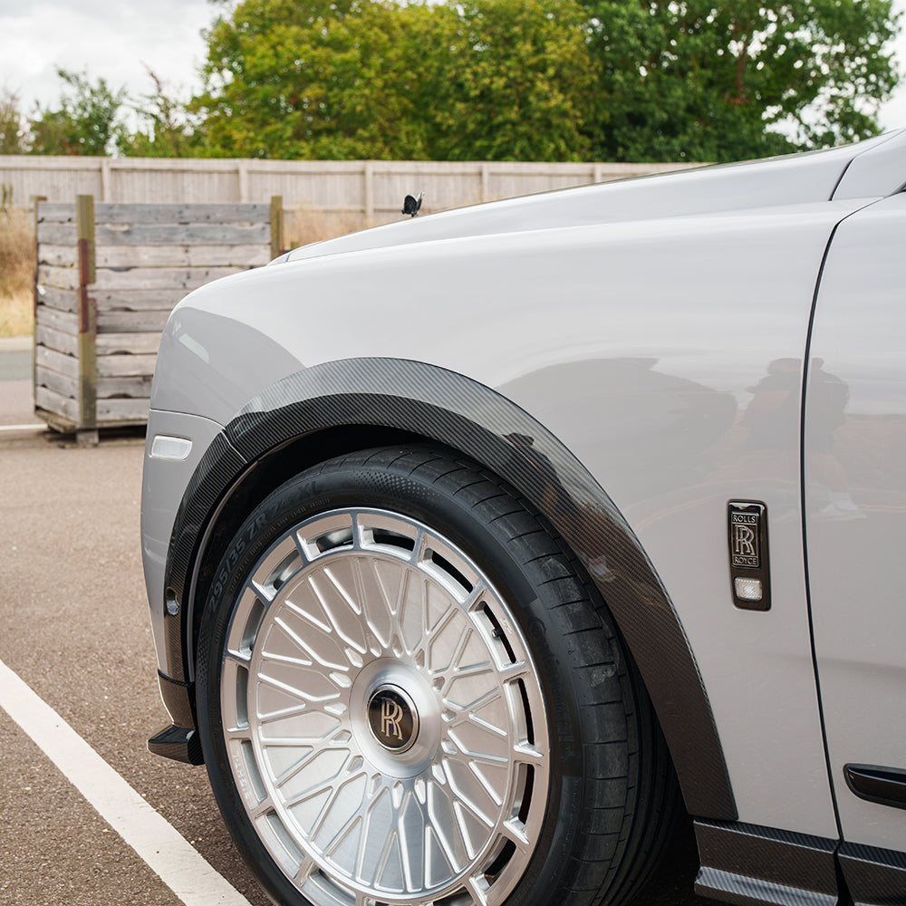 Full car carbon fiber kit for Rolls Royce Cullinan by CT Carbon, showing the sleek, glossy carbon fiber exterior parts.