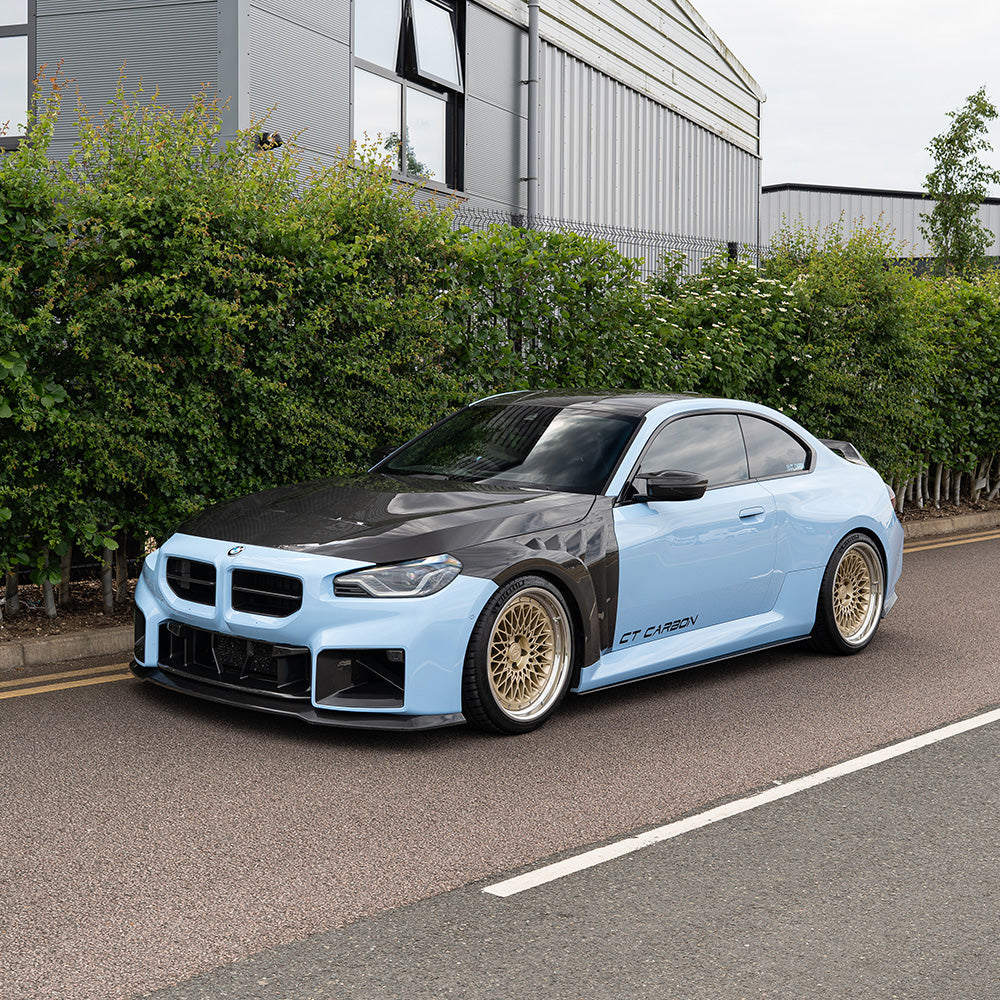 BMW G87 M2 CT Design full carbon fibre kit, including front splitter, side skirts, and rear diffuser, showcased on the car.