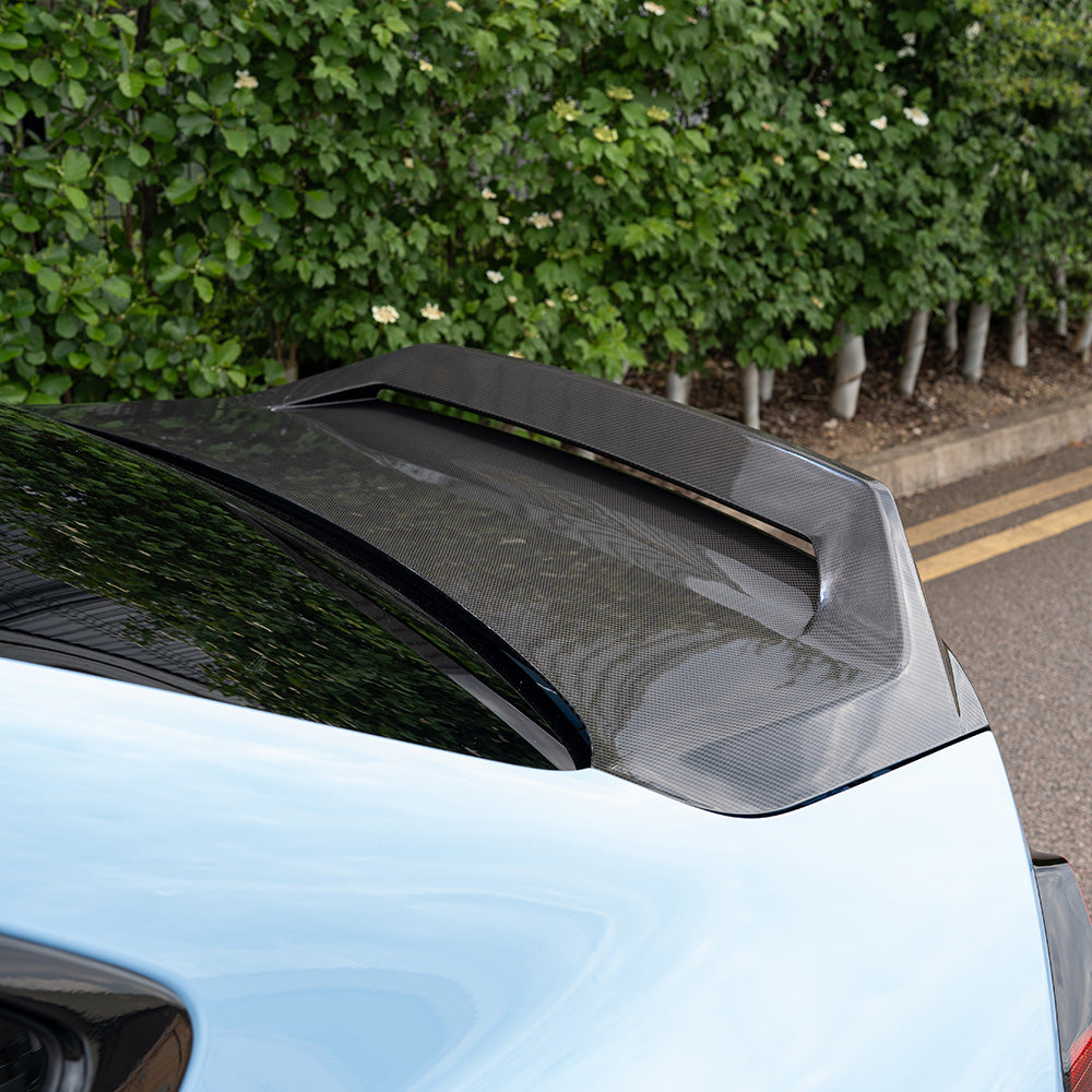 BMW G87 M2 CT Carbon full car carbon fiber kit, including front splitters, side skirts, and rear diffuser, installed on the vehicle.