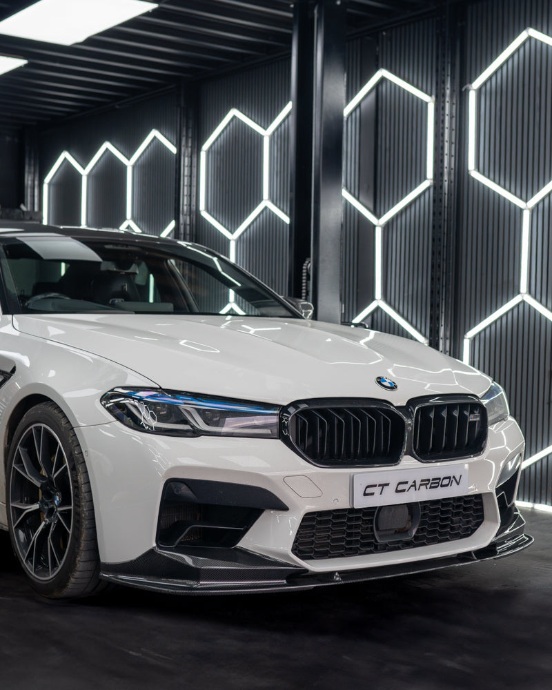 BMW F90 M5 carbon fibre splitter by CT Carbon, close-up of the sleek, aerodynamic V4 splitter installed on the front bumper.