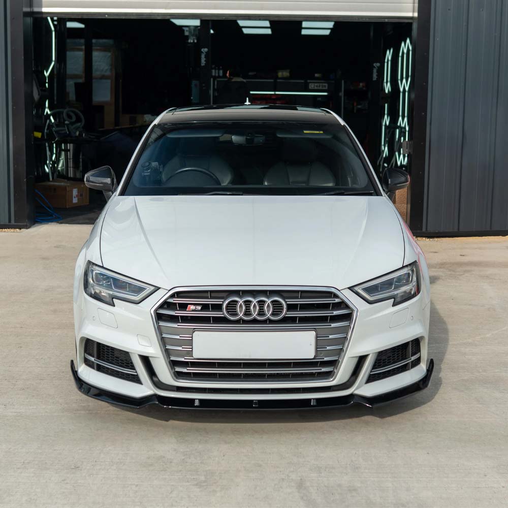 Gloss black splitter for Audi A3 S-Line and S3 8V facelift (2017-2020) by CT Carbon, shown installed on the vehicle's front bumper.