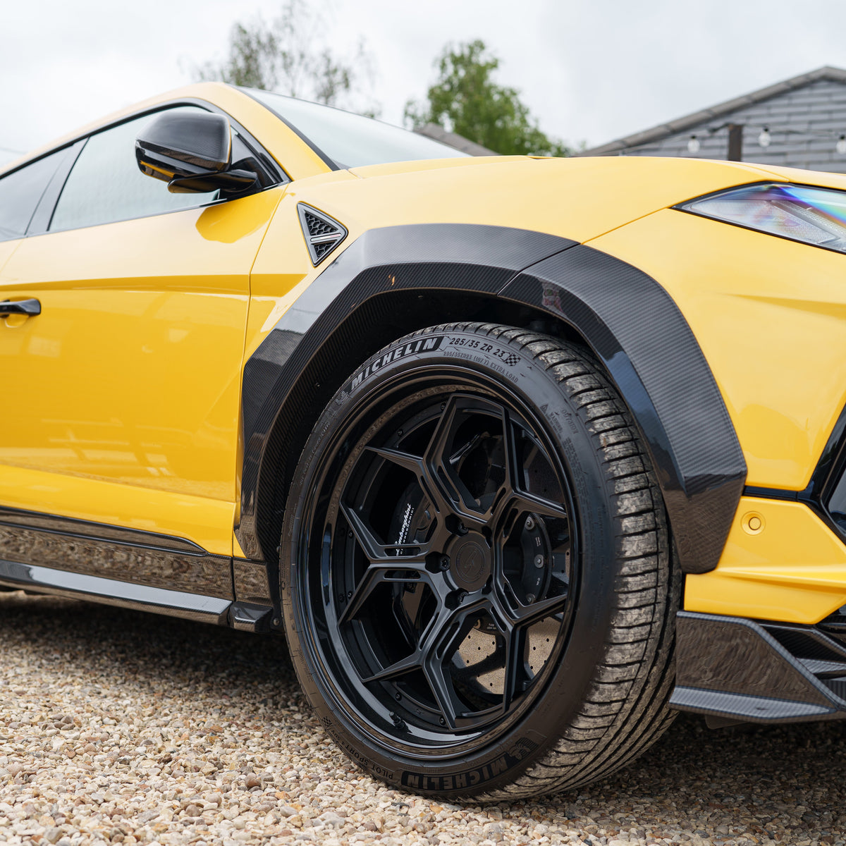 Lamborghini Urus Performante full carbon fiber kit by CT Carbon, showcasing sleek, lightweight carbon fiber components on the car.