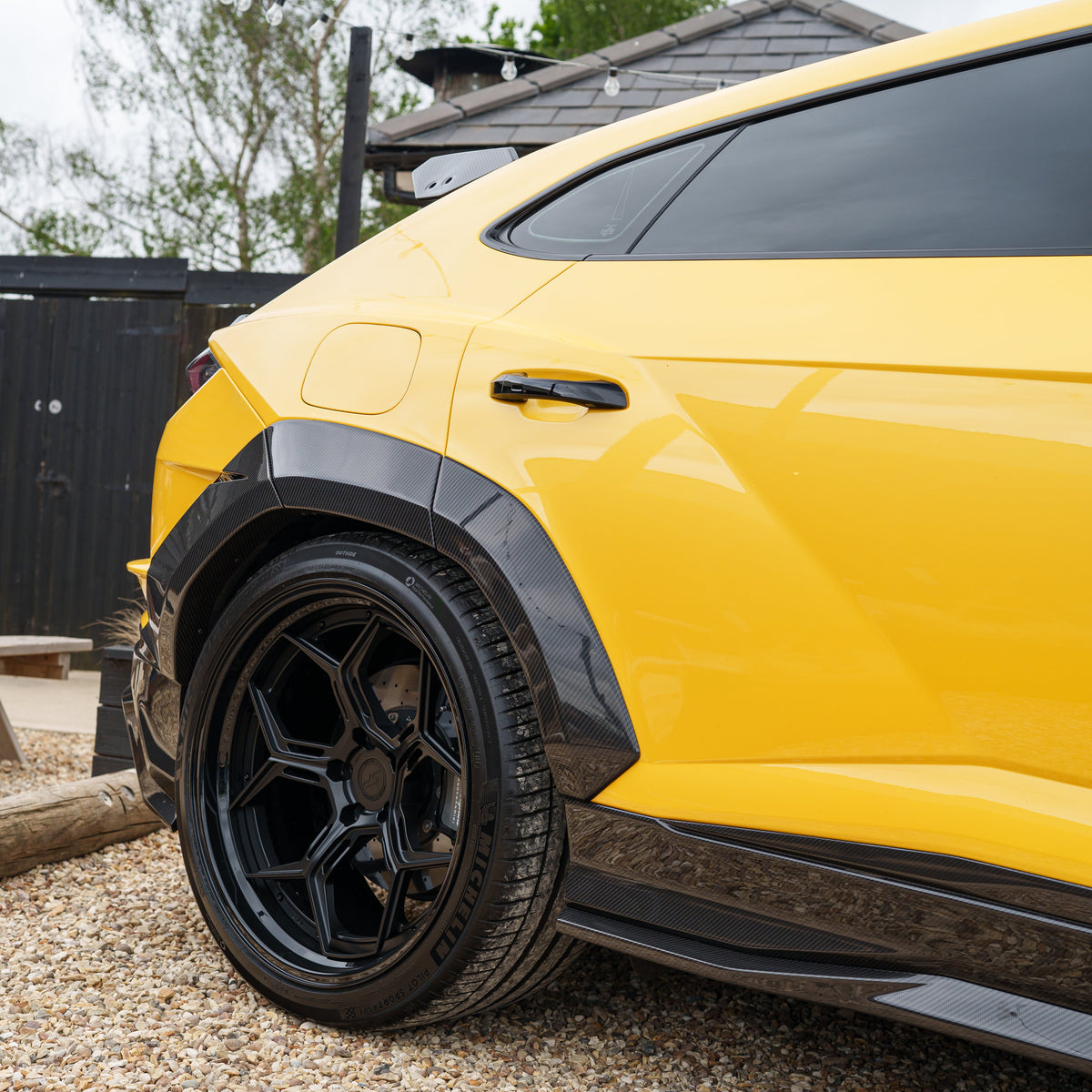 Lamborghini Urus Performante full carbon fibre kit by CT Carbon, showcasing sleek carbon fibre panels and aerodynamic enhancements.