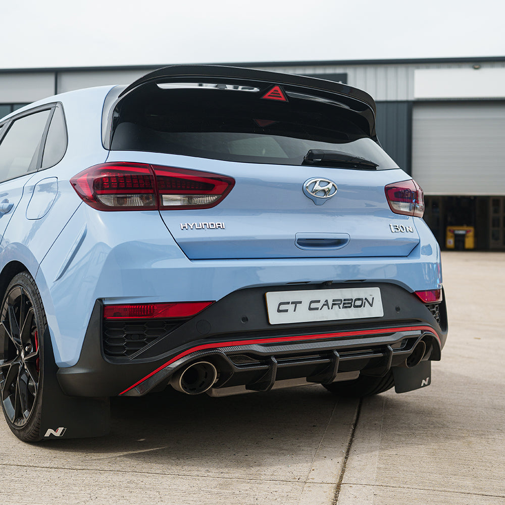 CT Carbon Hyundai i30N carbon fibre kit for facelift model, featuring sleek carbon fibre components on a car.