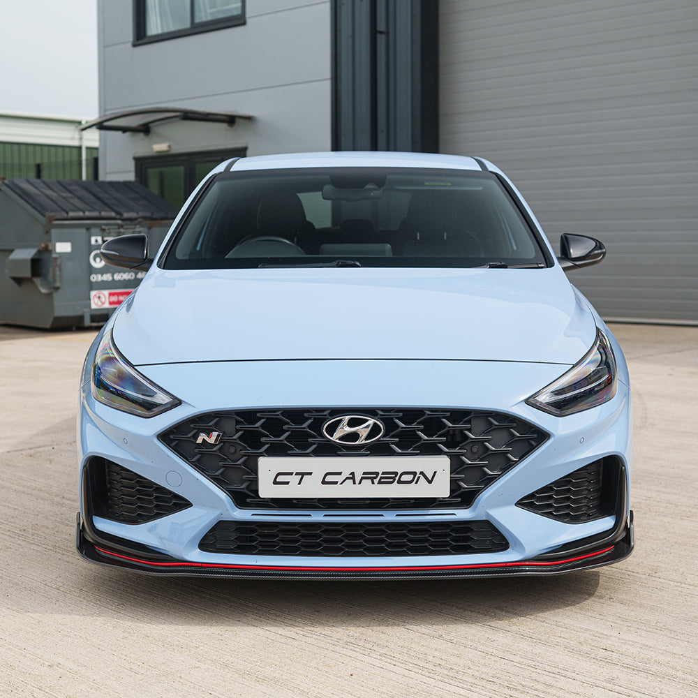 CT Carbon Hyundai i30N carbon fibre kit for facelift model, featuring sleek, lightweight carbon fibre components on a car.