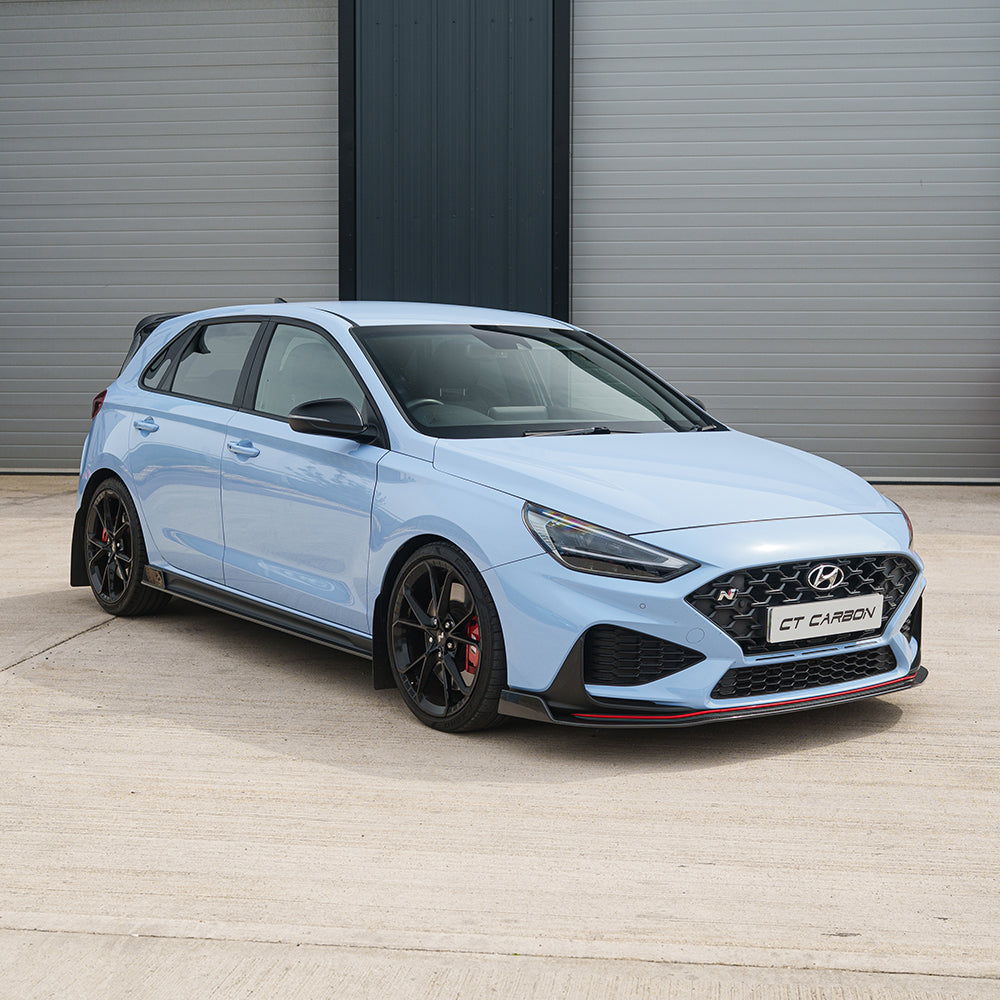 CT Carbon Hyundai i30N carbon fibre kit for facelift model, showing sleek, lightweight carbon fibre components on a sporty hatchback.