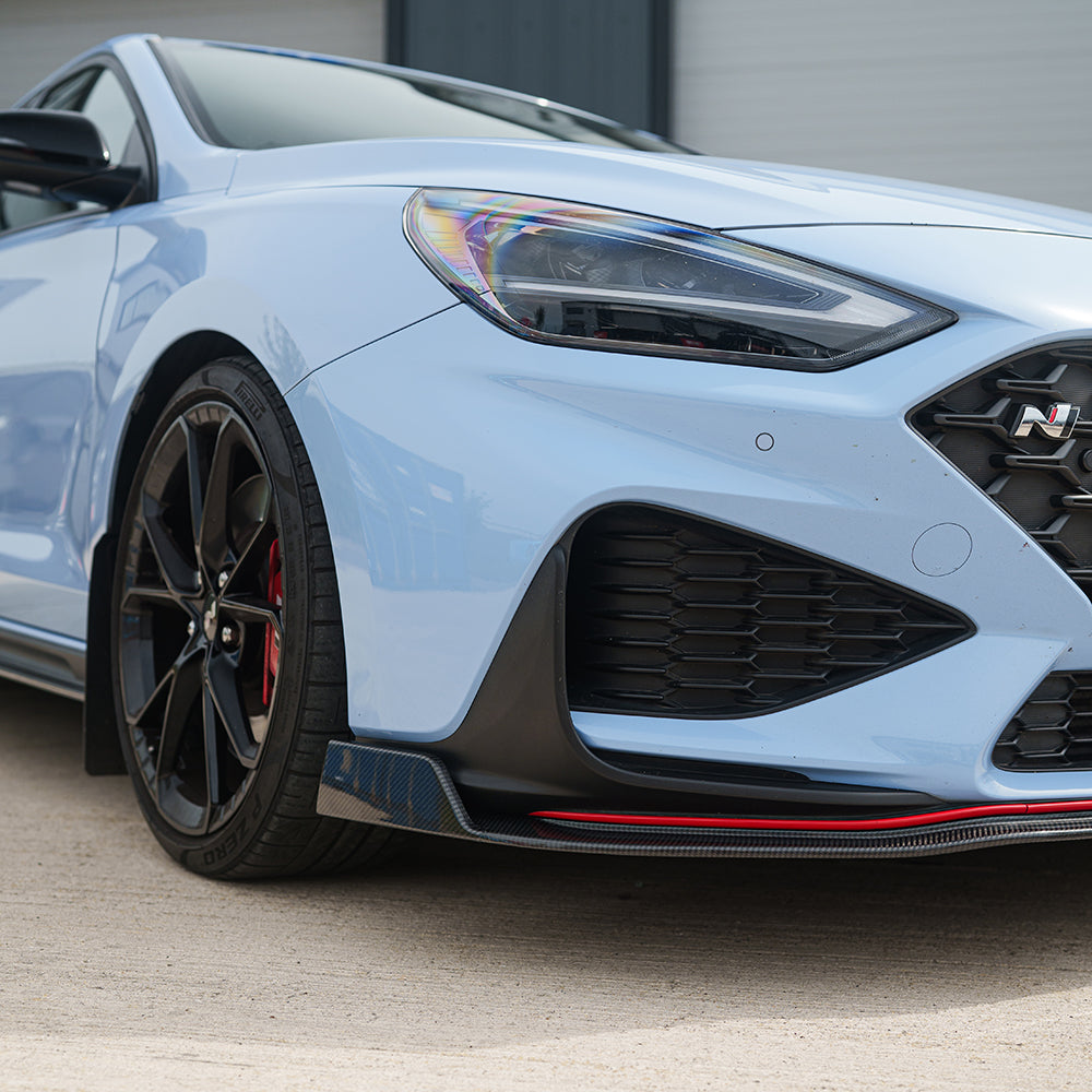 Hyundai i30N carbon fibre kit by CT Carbon with facelift design, featuring sleek, lightweight carbon fibre components for sporty look.