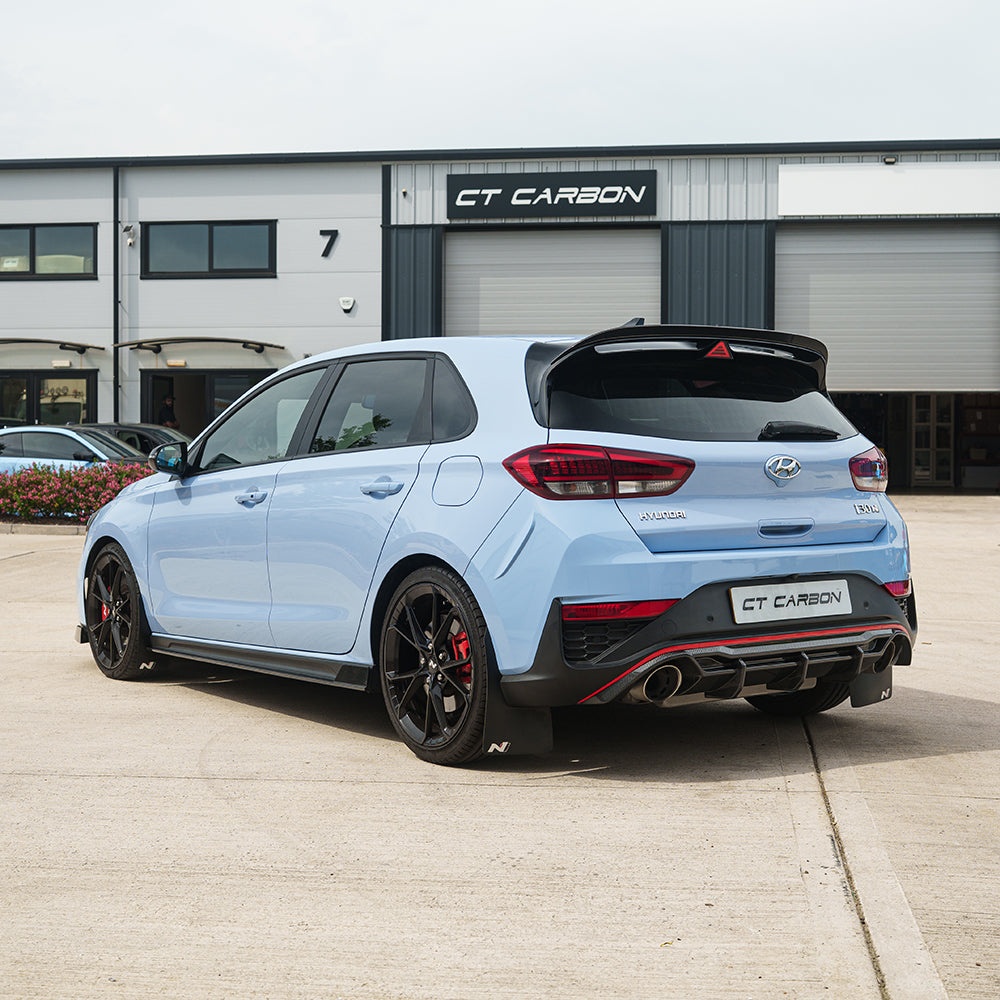 CT Carbon Hyundai i30N carbon fibre kit for facelift model, featuring sleek, lightweight carbon fibre components on a modern car.