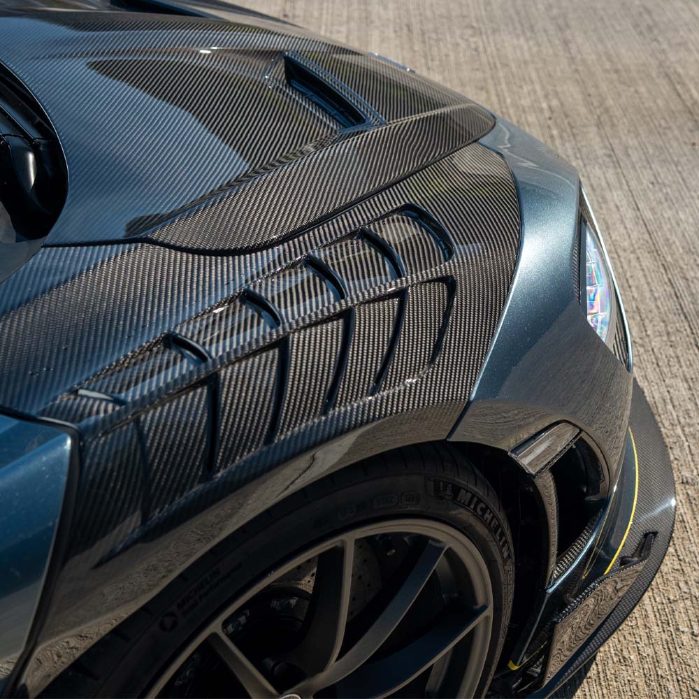 Carbon fiber kit for McLaren 720S, CT Design Ultimate Kit by CT Carbon, showing sleek, high-quality automotive exterior parts.