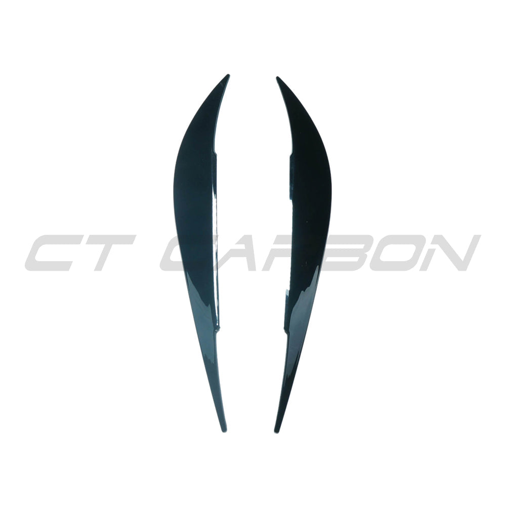 BMW M4 F82/F83 and 4 Series F32/F33/F36 gloss black headlight eyebrows accessory by CT Carbon, close-up of the sleek eyelid design.