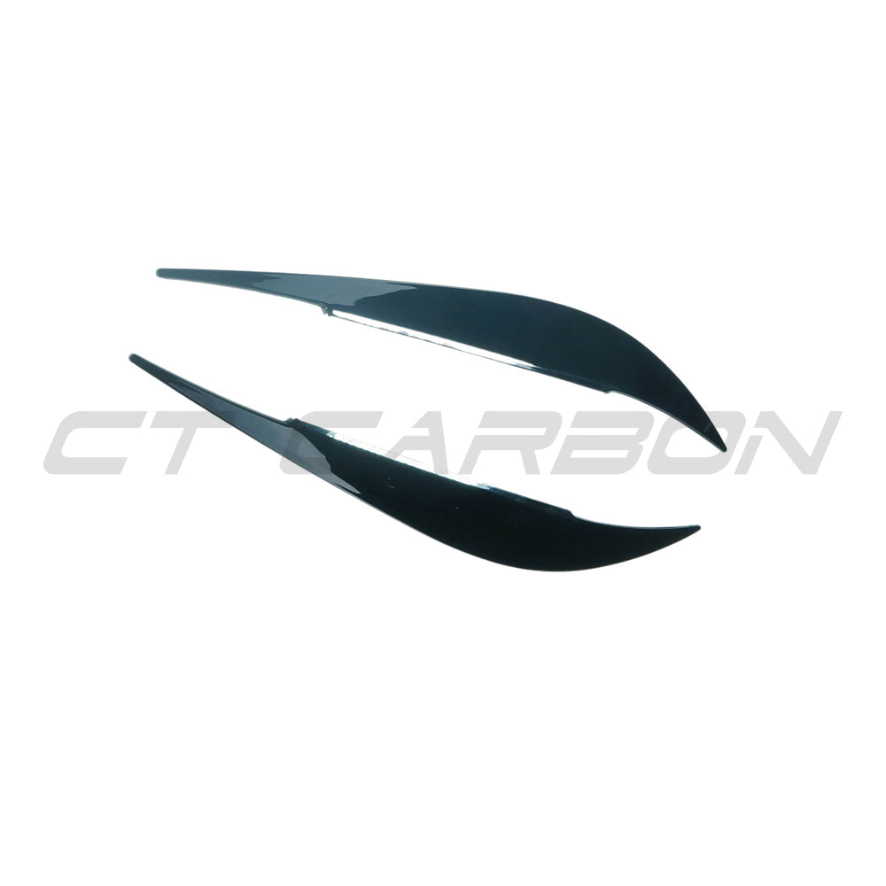 Gloss black BMW M4 F82/F83 and 4 Series F32/F33/F36 headlight eyebrows by CT Carbon, accessory for enhanced front-end style.