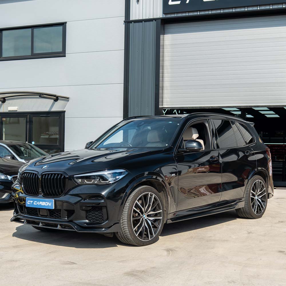 BMW G05 X5 CT Carbon full carbon fiber kit V1 installed on the vehicle, showcasing sleek, high-quality carbon fiber details.