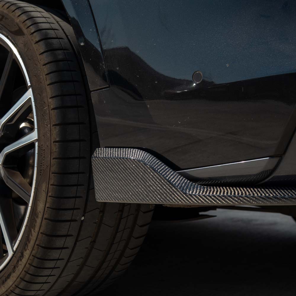 BMW G05 X5 CT Carbon full car carbon fiber kit installed, showing sleek, glossy carbon fiber panels on the vehicle's exterior.