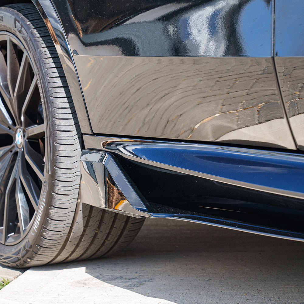 BMW G05 X5 2018-2023 CT Carbon full black plastic kit installed on vehicle, showcasing sleek, matte black exterior components.