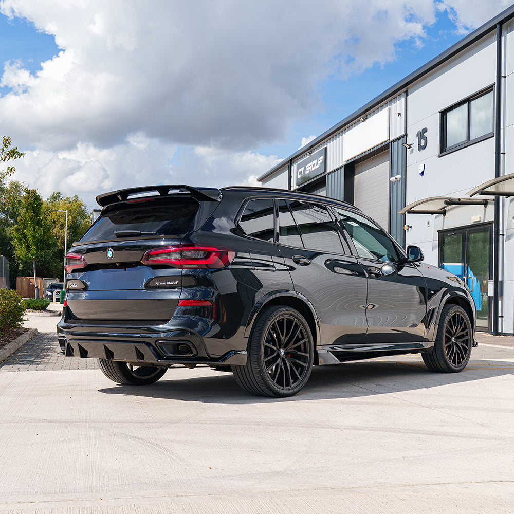 BMW G05 X5 2018-2023 CT Carbon full black plastic kit, shown in the image with various vehicle exterior components.
