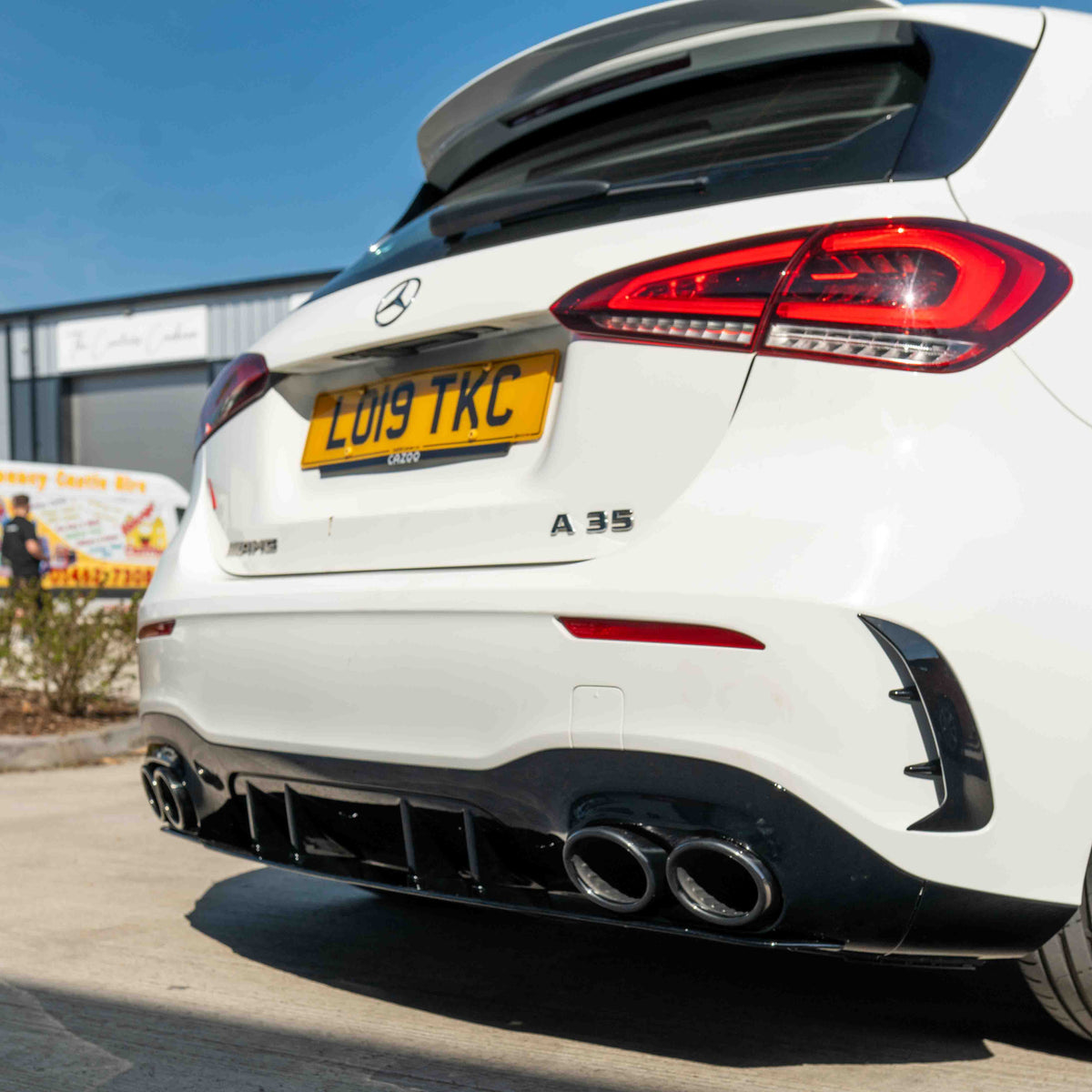 Mercedes A-Class W177/V177 2018-current CT Carbon gloss black quad tip diffuser installed on the rear of the vehicle.
