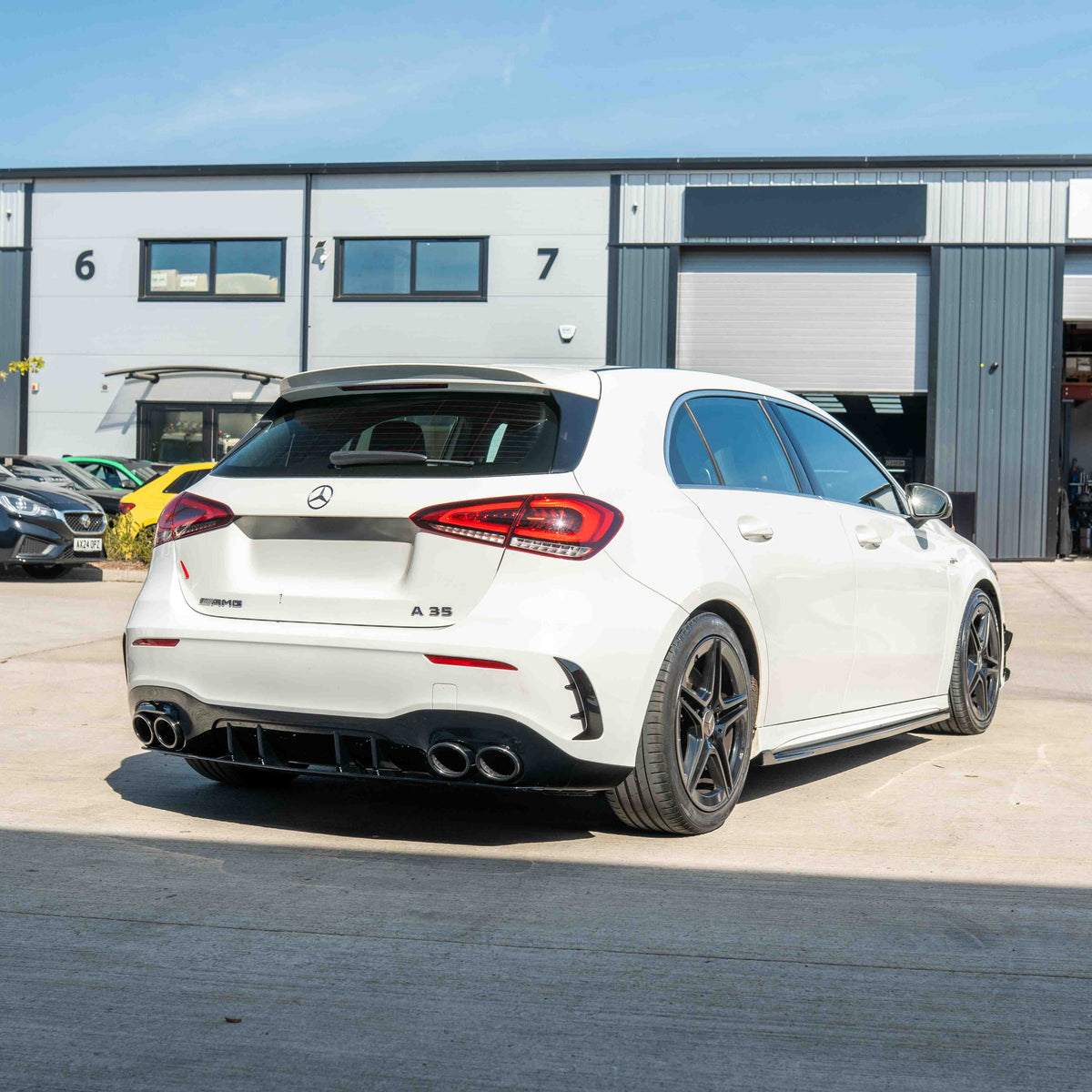 Mercedes A-Class W177/V177 2018-current CT Carbon gloss black quad tip diffuser installed on the rear of the vehicle.