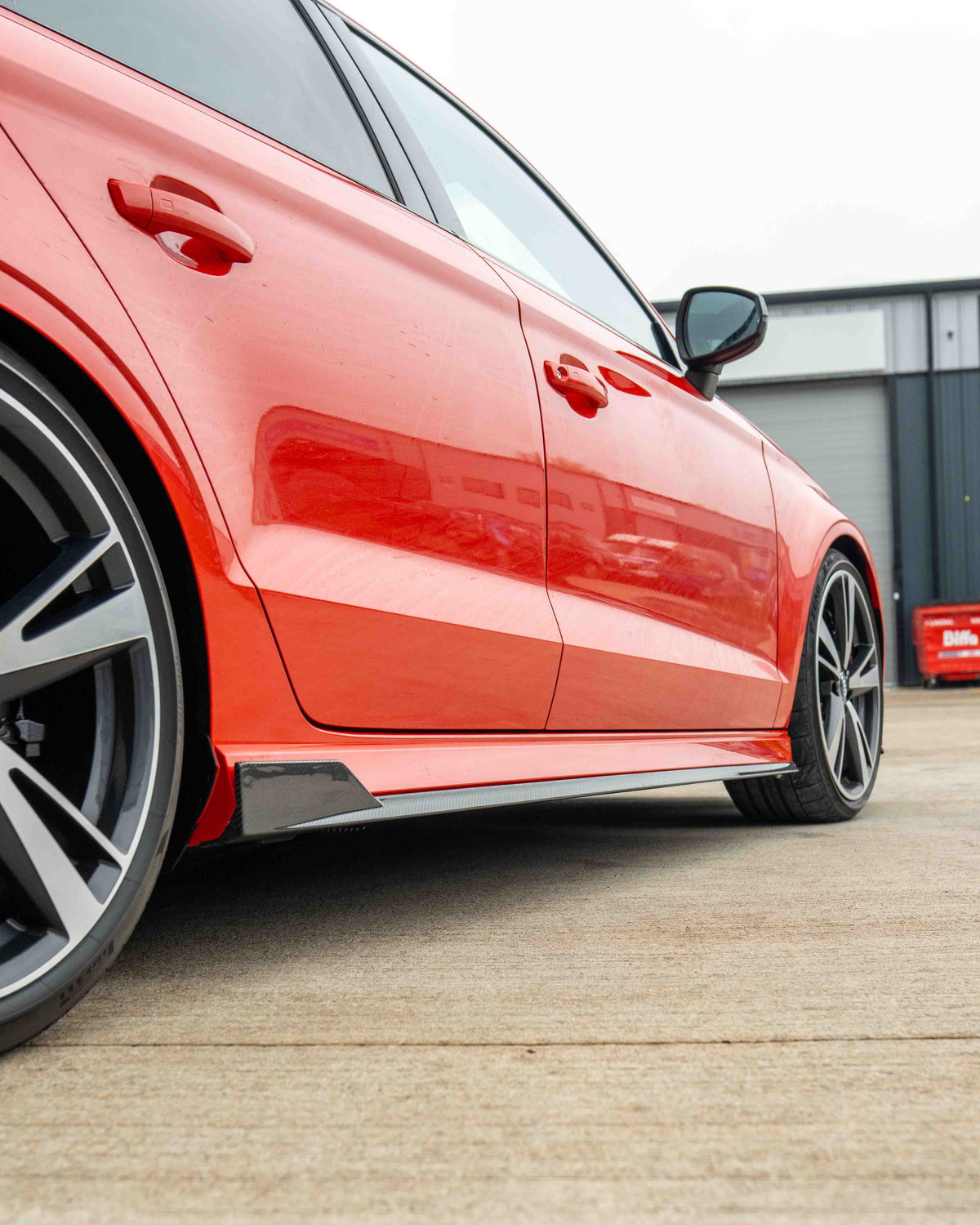 CT Carbon carbon fibre side skirts for Audi A3/S3/RS3 8V saloon car, showcasing sleek, aerodynamic design and high-quality finish.