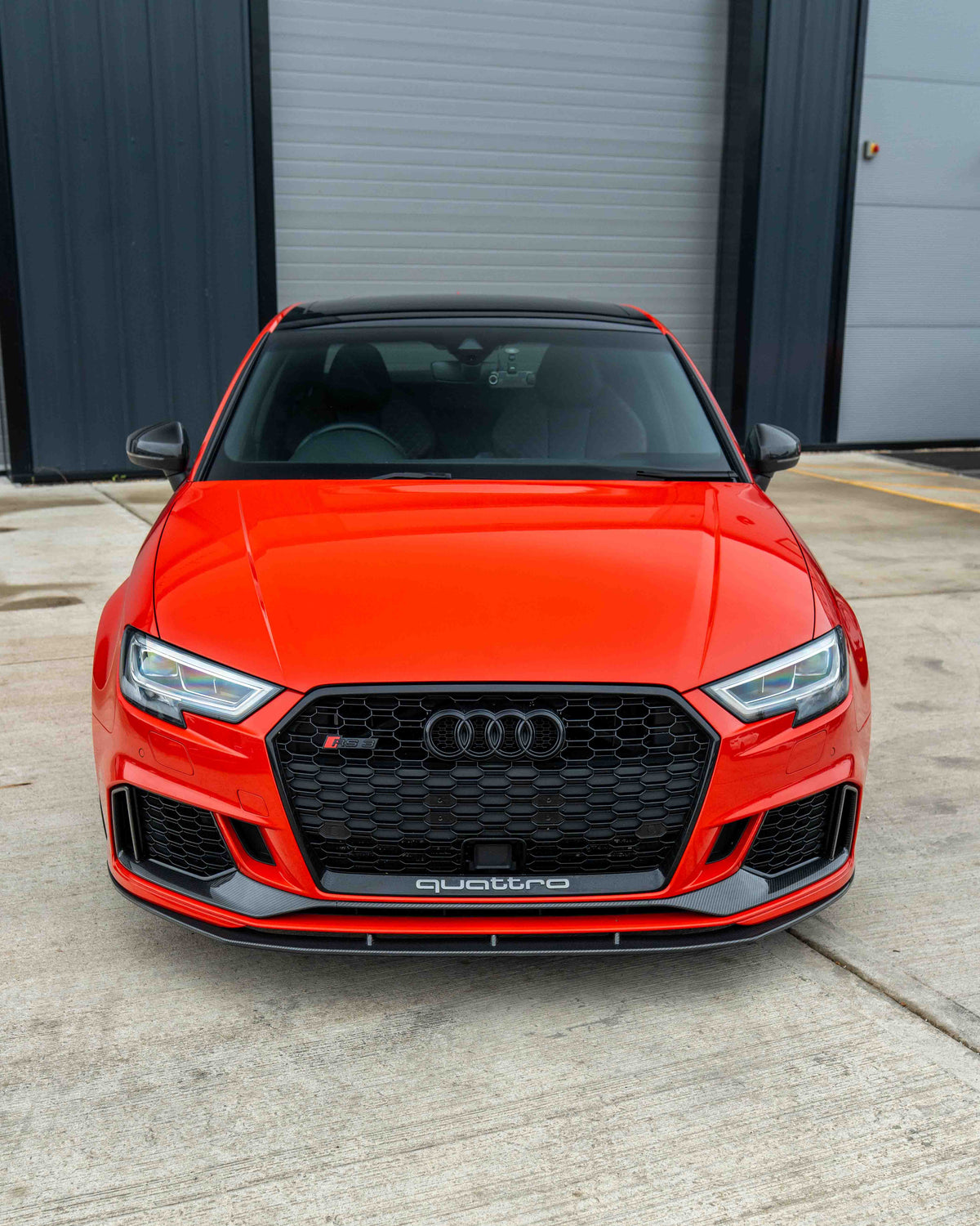 CT Carbon Audi RS3 8V saloon carbon fibre splitter V1 installed on front bumper, showcasing lightweight aerodynamic design.