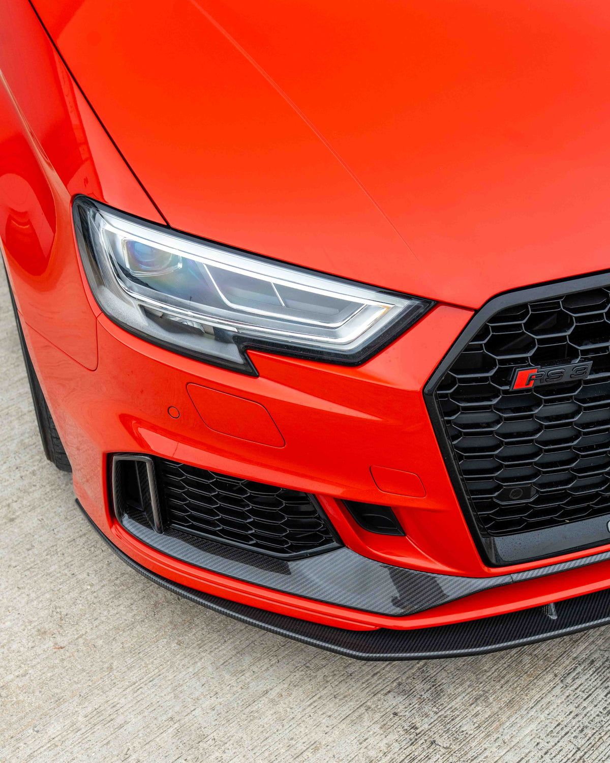 CT Carbon Audi RS3 8V saloon carbon fibre splitter V1 installed on front bumper, showcasing sleek aerodynamic design.