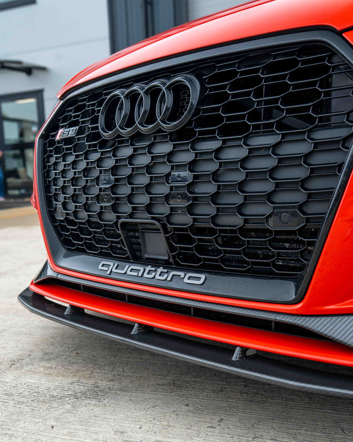 CT Carbon Audi RS3 8V saloon carbon fibre splitter V1 installed on front bumper, showcasing lightweight, aerodynamic design.
