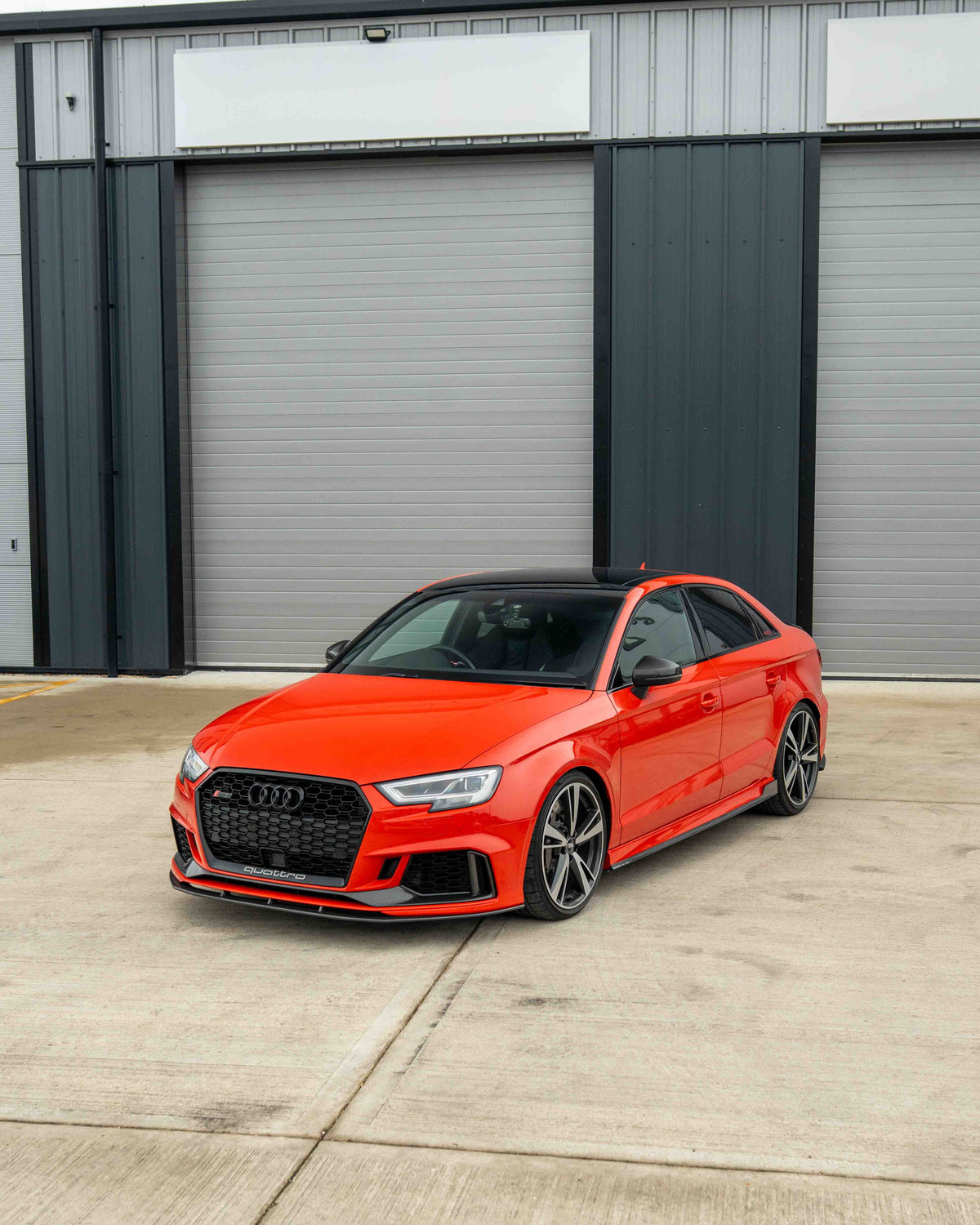 CT Carbon Audi RS3 8V saloon carbon fibre splitter V1 installed on front bumper, showcasing sleek aerodynamic design.