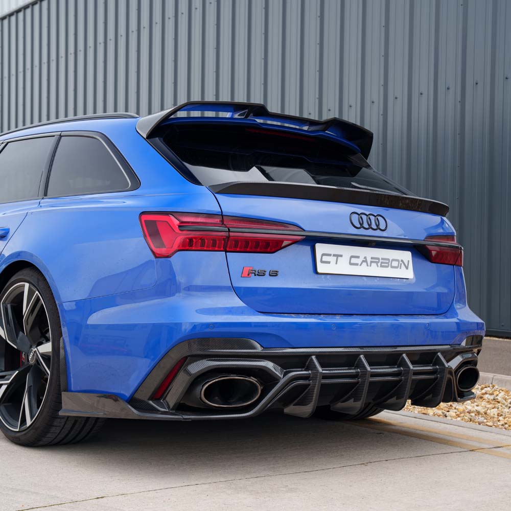 Audi RS6 C8 full carbon fiber kit by CT Carbon, showing detailed carbon fiber panels and sleek automotive design.