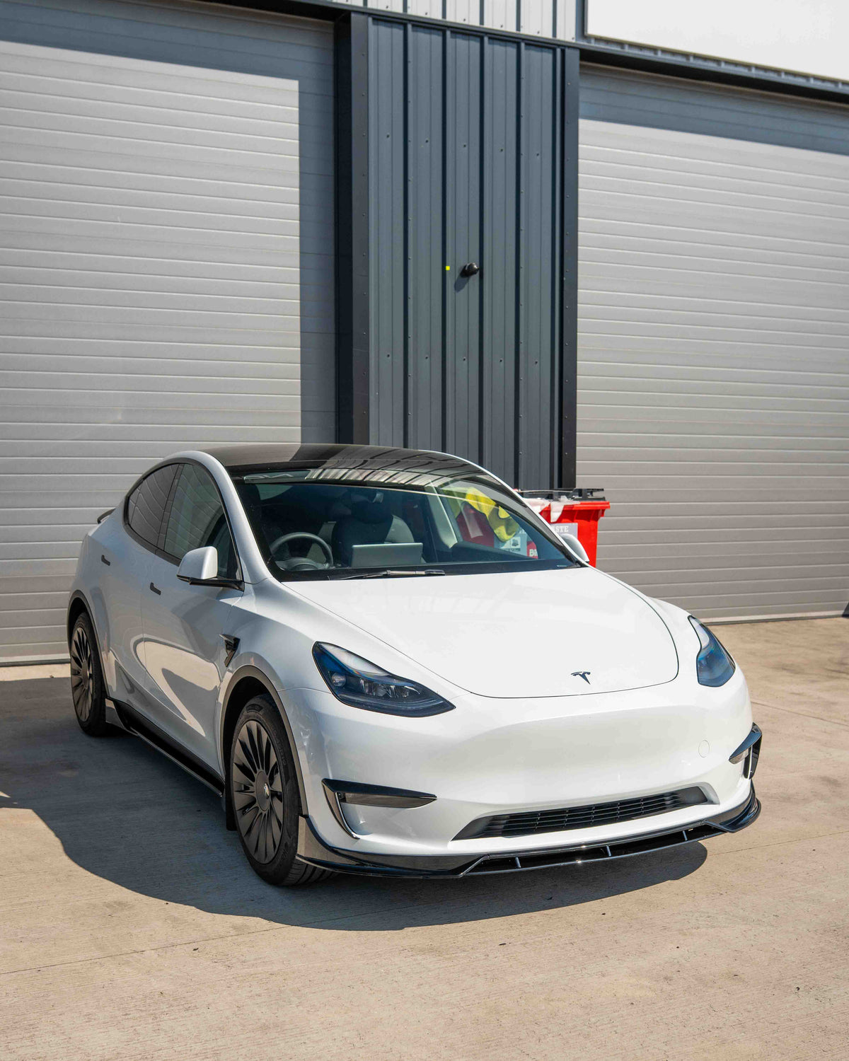 Full gloss black kit for Tesla Model Y MK1 2020-2025 by CT Carbon, including detailed close-up of the kit components.