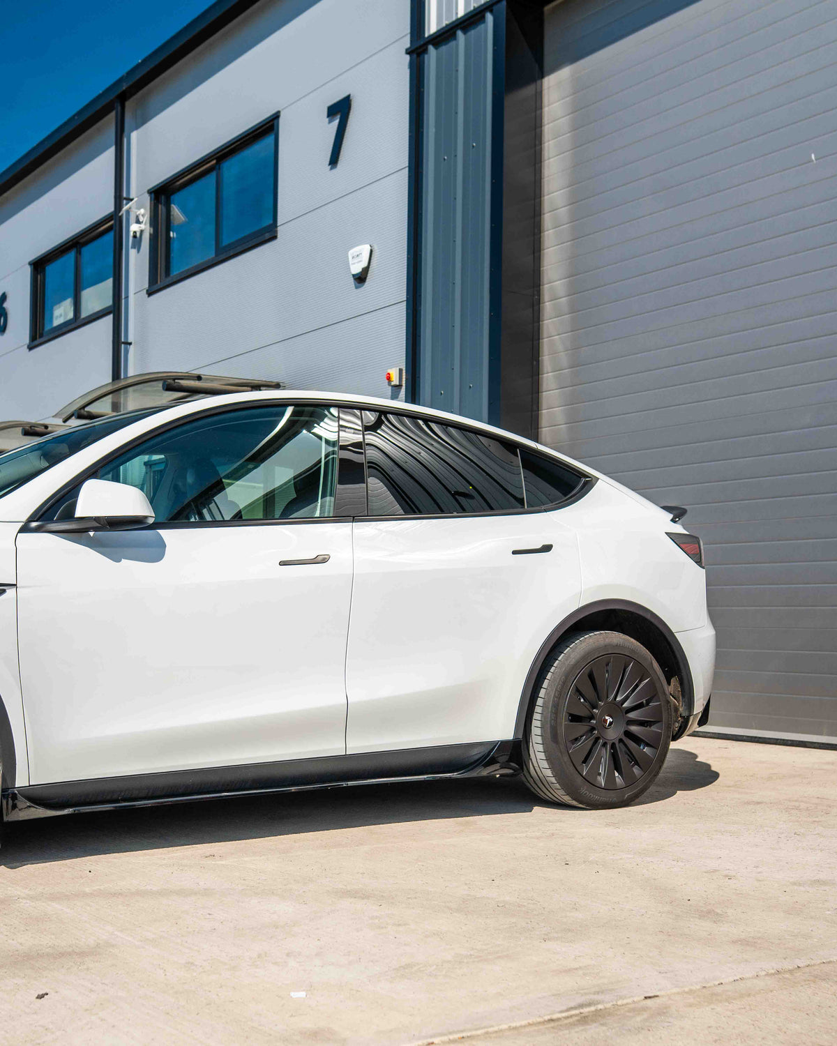 Full gloss black kit for Tesla Model Y MK1 2020-2025 by CT Carbon, featuring sleek, glossy car accessories and trim components.