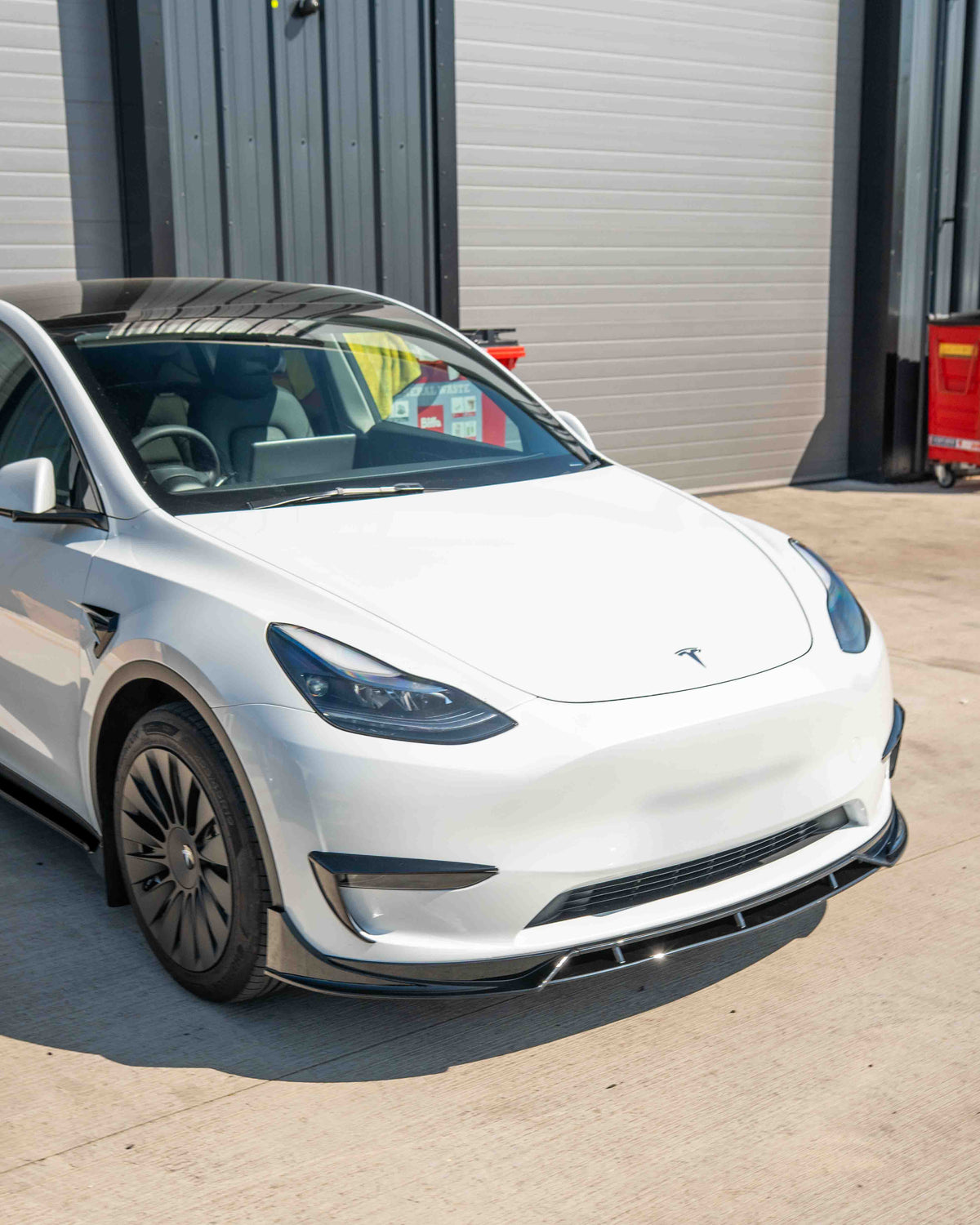 Full gloss black kit for Tesla Model Y MK1 2020-2025 by CT Carbon, shown in the image with applied black accents and detailing.