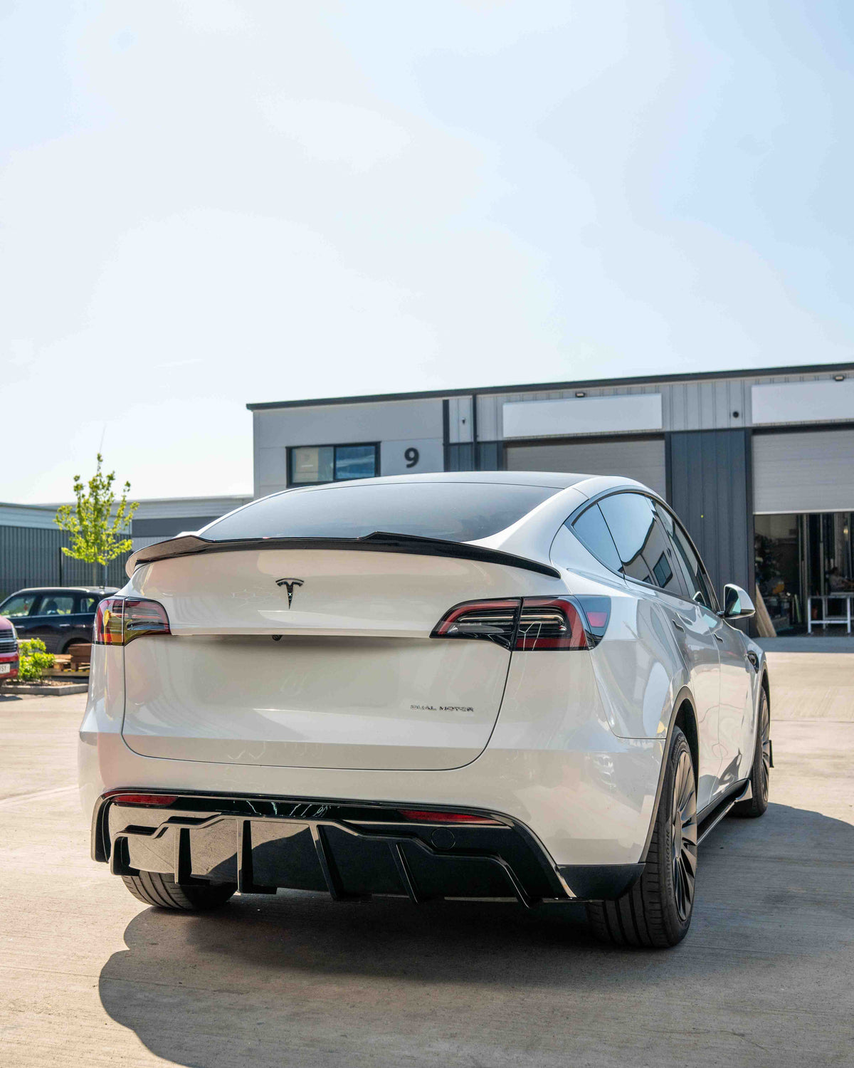 Full gloss black kit for Tesla Model Y MK1 2020-2025 by CT Carbon, shown in the image with sleek black accents.