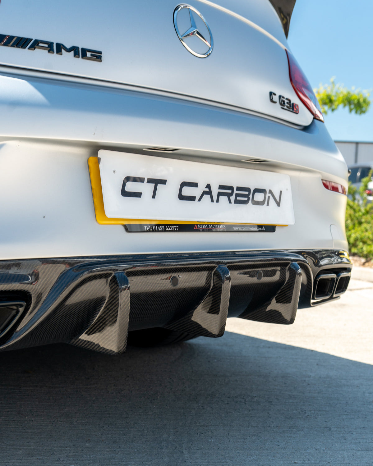 CT Carbon Mercedes W205 C63 Coupe carbon diffuser V1, sleek black rear car part with intricate design details.