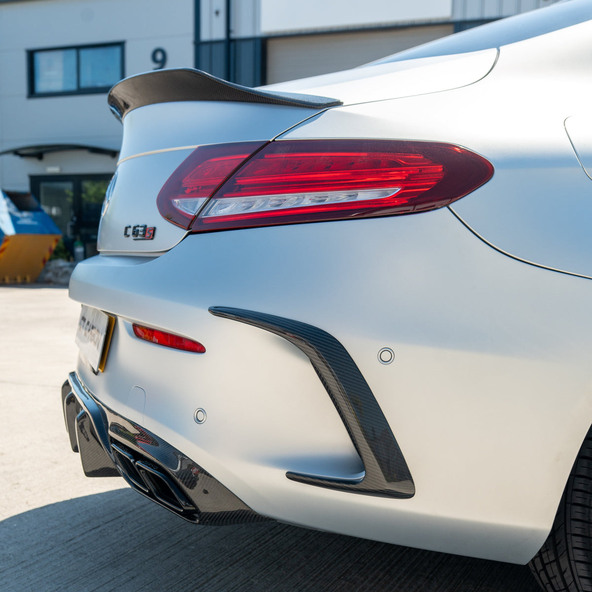 Carbon spoiler for Mercedes C63/C63S W205 Coupe by CT Carbon, showing sleek aerodynamic design on the V1 model.