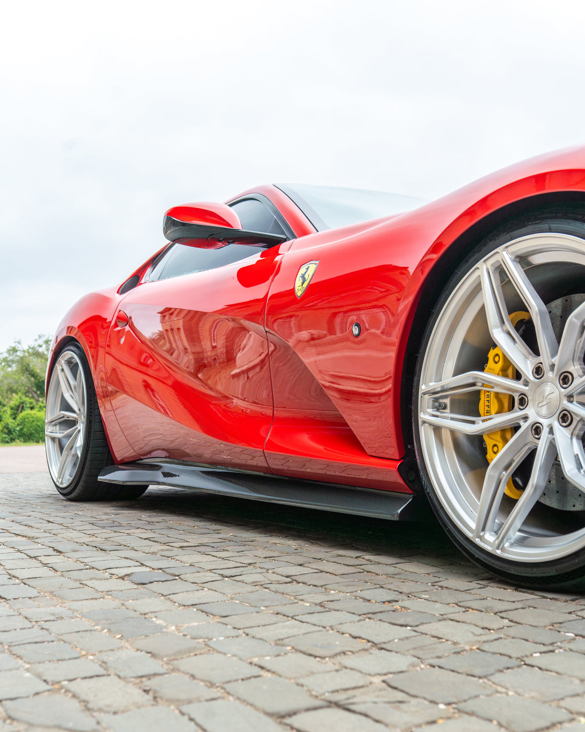 Close-up of the CT Carbon Ferrari 812 Superfast carbon fibre kit V1 with detailed weave and finishing on a sleek sports car component.