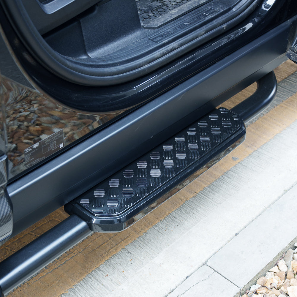 Land Rover Defender 110 L663 side steps by CT Carbon, durable accessories with sleek design for added vehicle convenience.