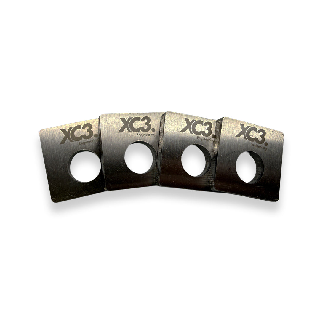 BMW M3 E9X E92 camber lockout shims for suspension and alignment by XC3 Engineering, shown in close-up detail.