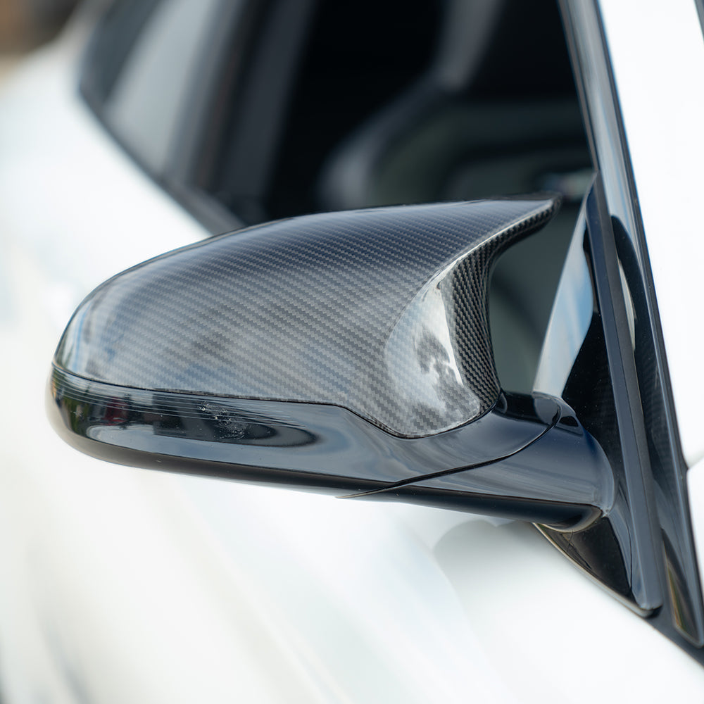 BMW F80/F82/F83/F87 M2C M3 M4 carbon fiber side mirrors by CT Carbon, RHD compatible, shown on a sleek F82 M4.