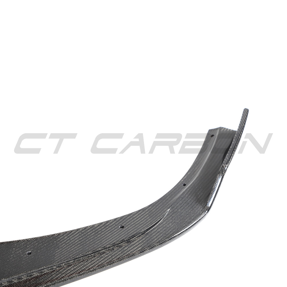 Hyundai i30N front carbon fiber splitter by CT Design, pre-facelift model, shown mounted on the vehicle's front bumper.