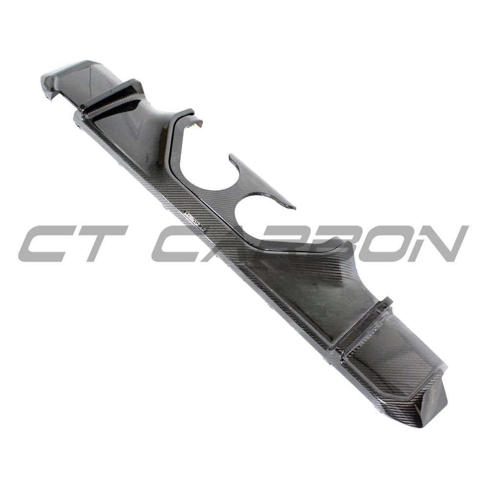 BMW M3 M4 G80 G81 G82 G83 CT Carbon middle outlet diffuser, black aerodynamic car part with textured finish.