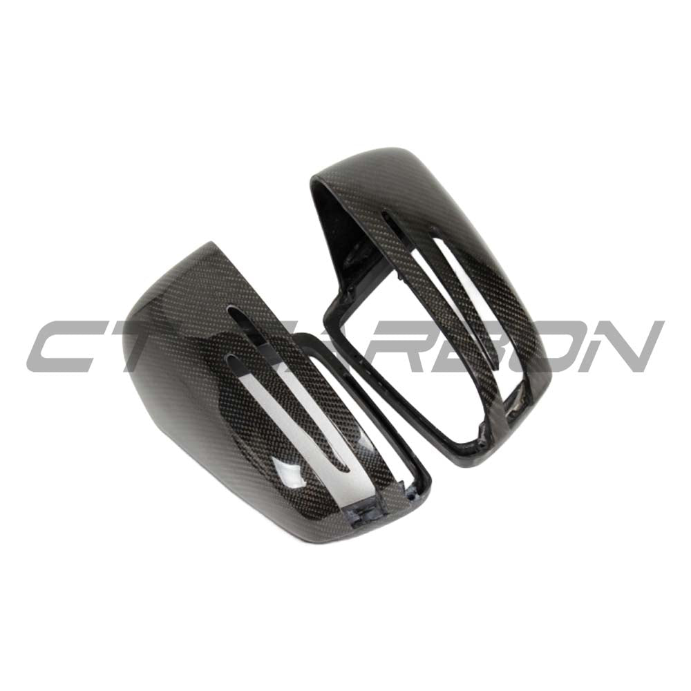 Mercedes C & E Class W204/W212 carbon fiber mirror covers by CT Carbon, close-up view of sleek, glossy black mirror accessories.
