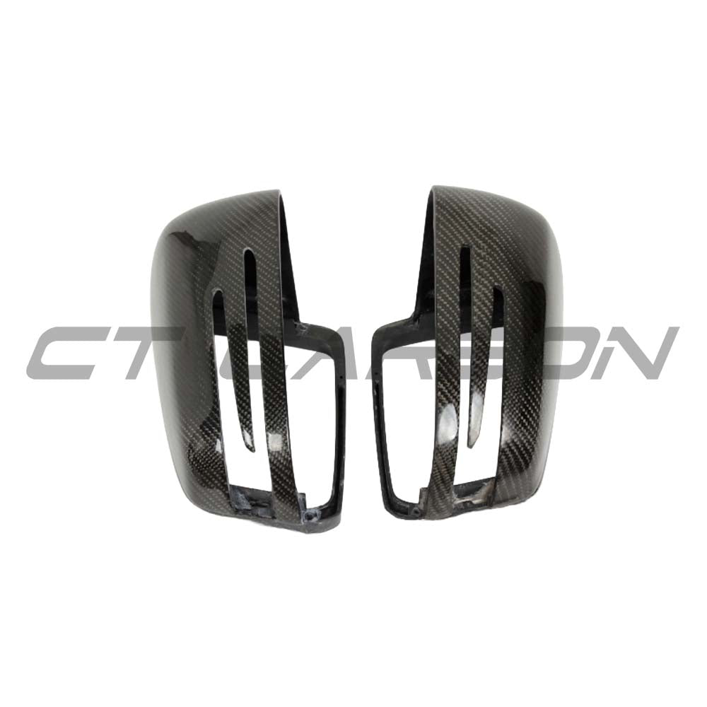 Mercedes C and E Class W204 W212 carbon fiber mirror covers by CT Carbon, showing sleek, textured mirror accessories on a vehicle.