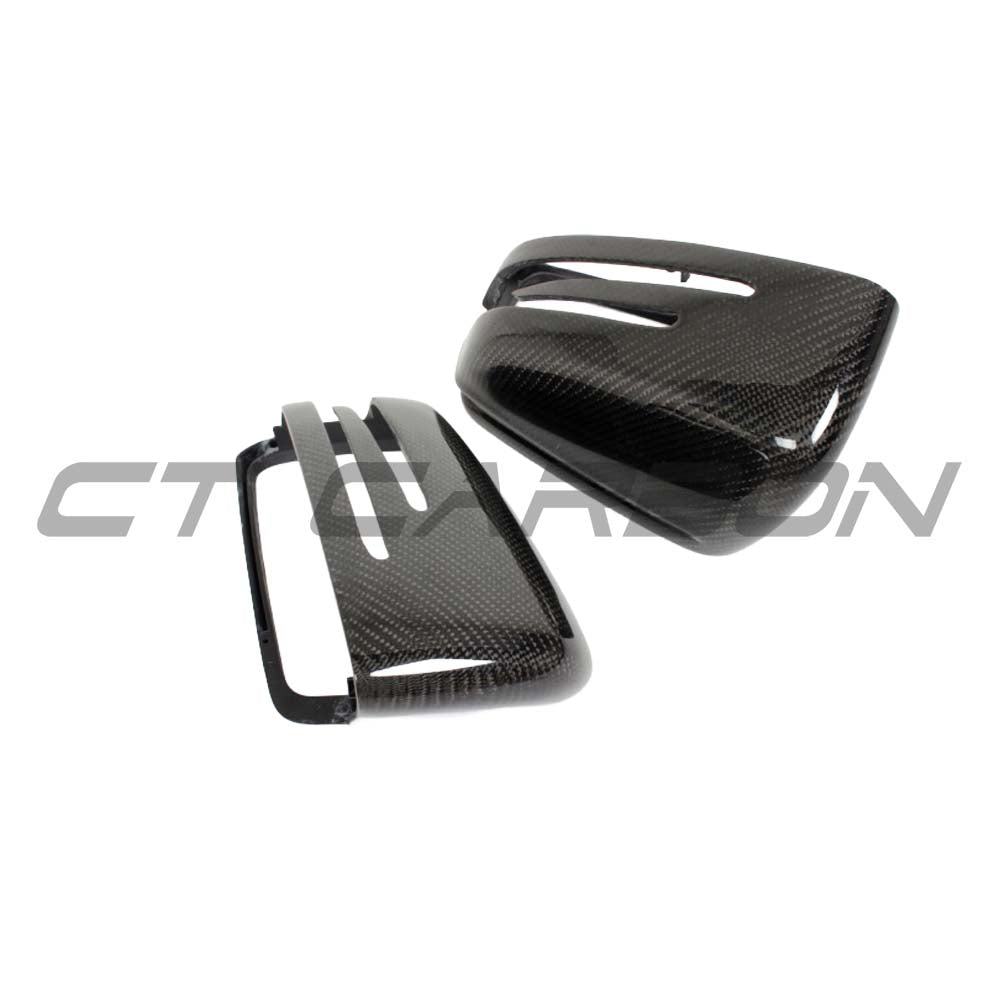 Carbon fibre side mirror covers for Mercedes C and E Class W204 W212 by CT Carbon, showcasing sleek, textured mirror accessories.