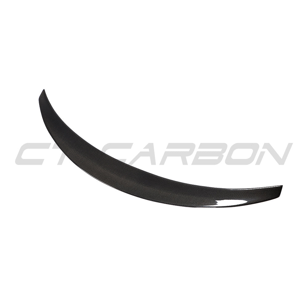 Tesla Model 3 2017-2023 CT Carbon V4 carbon fibre spoiler installed on the rear of the car, showcasing its sleek aerodynamic design.